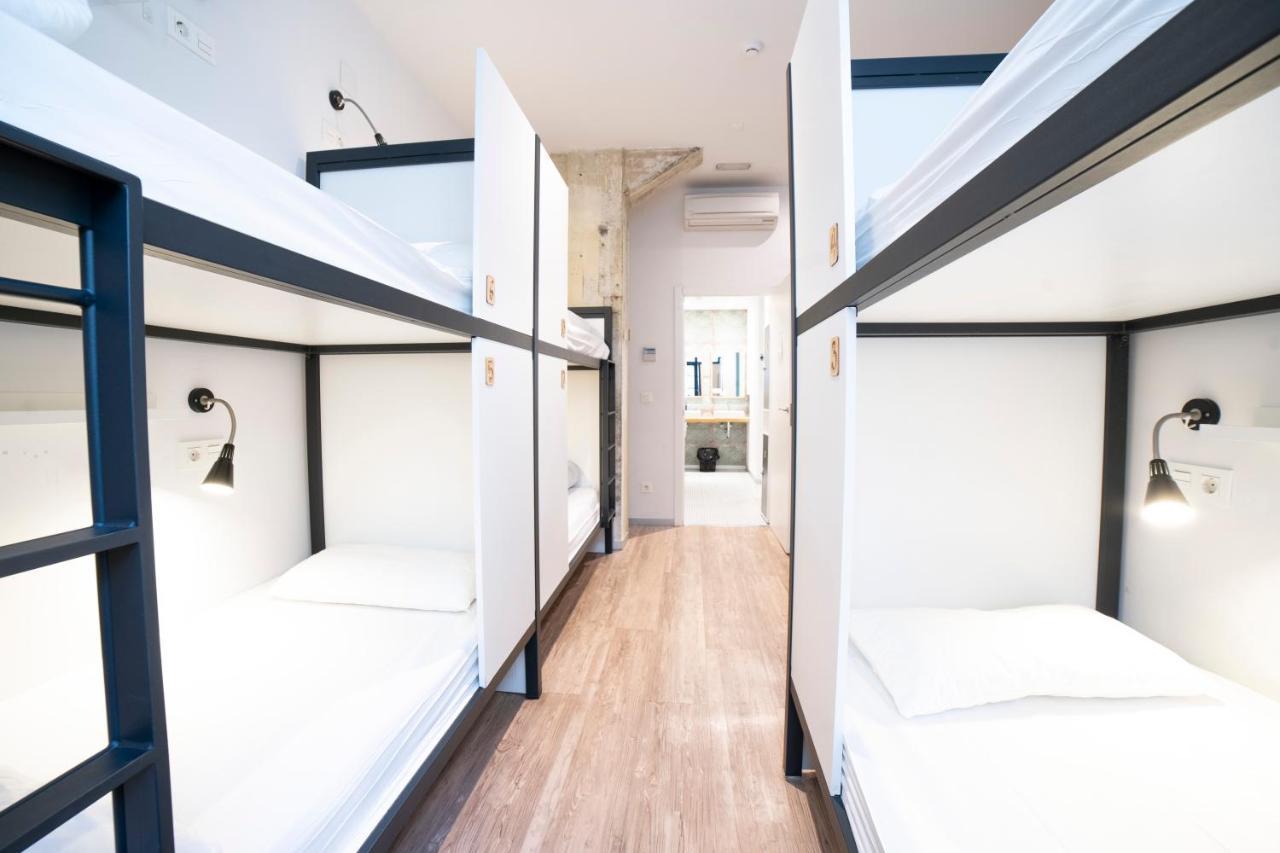 Bed in 8-Bed Dormitory Room with Private Bathroom